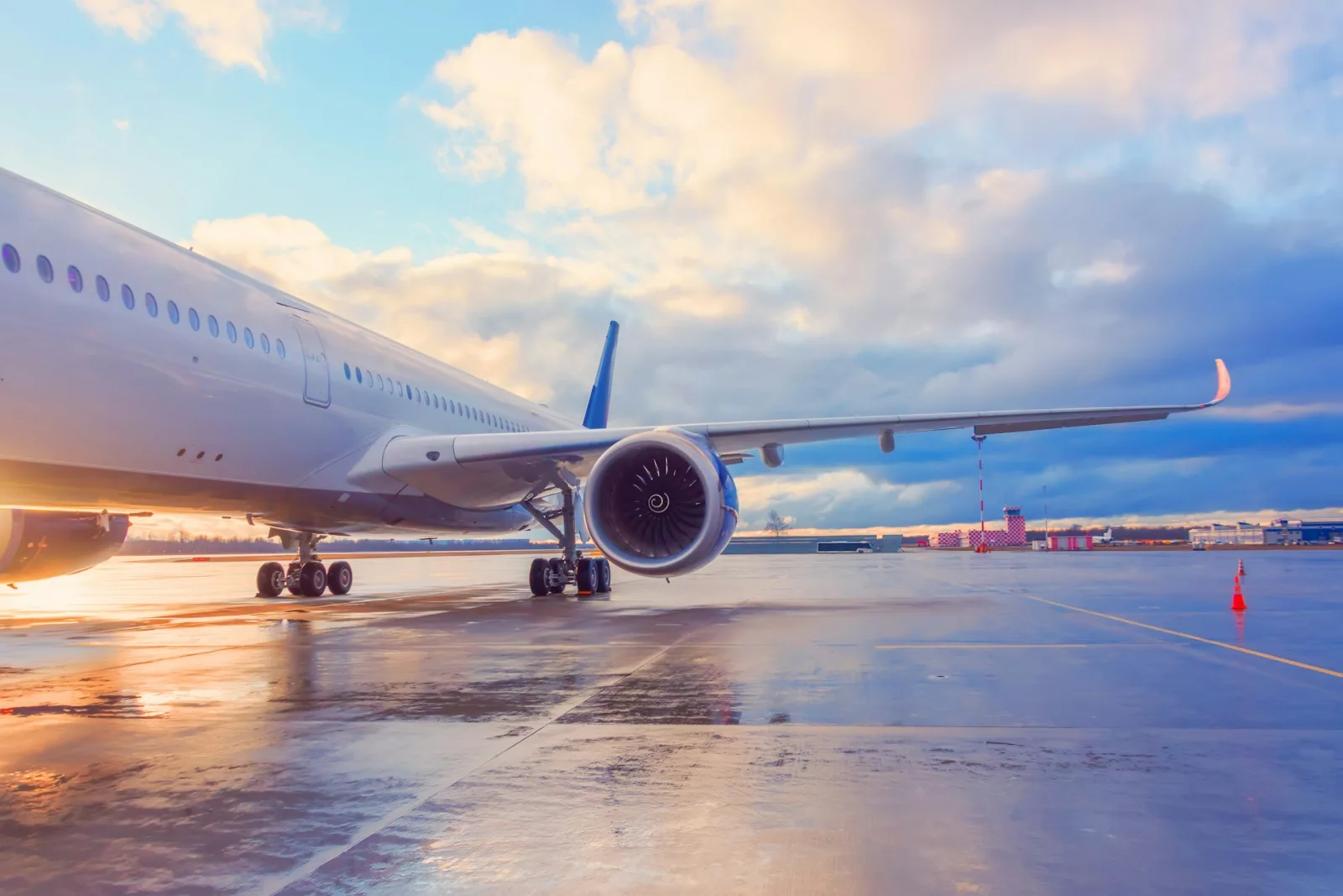 A wide-body airliner on the apron at sunrise